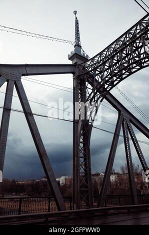 Old Volga Bridge, Tver, Russia, windy cloudy cold day in spring Stock Photo
