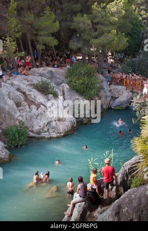 People swimming and having fun at Les Fonts de l'Agar, near Callosa, Spain Stock Photo