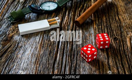 Two red dice on rustic wooden table with copy space Stock Photo - Alamy