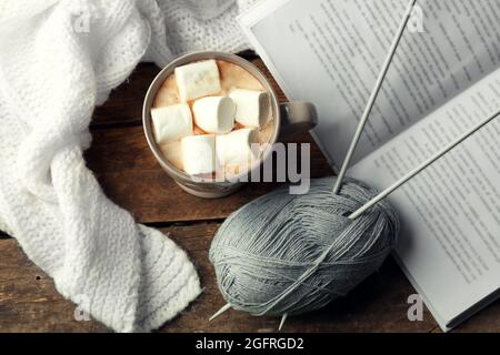 Hot drink with marshmallows on table, top view