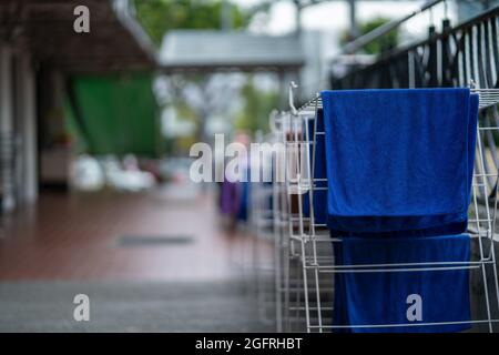 Fresh clean towels drying on washing line outdoor Stock Photo