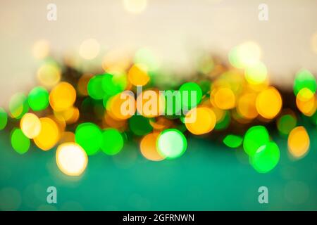 Bokeh from the lights of a garland. Festive mood. Defocus effect. Stock Photo