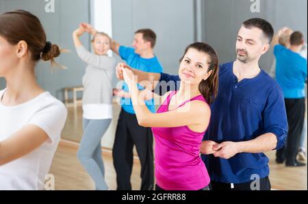 Young couple practicing active dance in pair Stock Photo