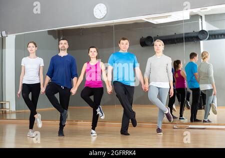 People fulfilling Celtic dance movements Stock Photo