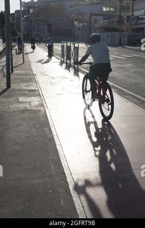 Salvador, Bahia, Brazil - May 30, 2021: Cyclist on the bike path in the Rio Vermelho neighborhood in Salvador (BA). Stock Photo