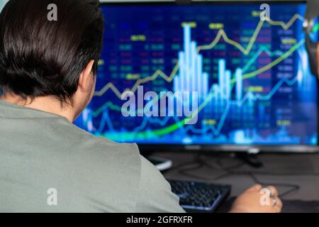 man traiding on computer Stock Photo