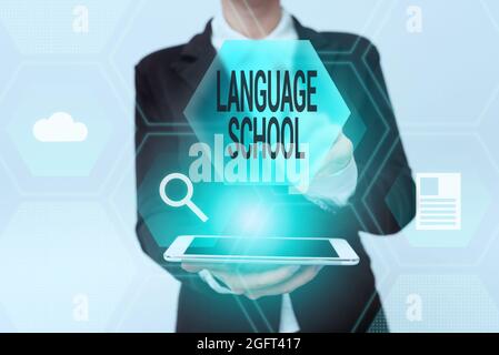 Inspiration showing sign Language School. Internet Concept educational institution where foreign languages are taught Woman In Uniform Holding Mobile Stock Photo