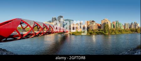 Calgary skyline at sunset with Peace Bridge and downtown in Calgary, Alberta, Canada. Stock Photo
