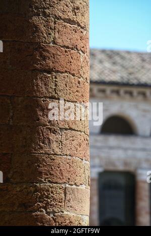 a round brick pillar of the Foro Annonario square against a blur background Stock Photo