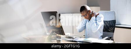 Neck Pain Bad Posture Stress At Computer In Office Stock Photo