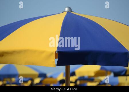 open beach umbrella under the sunlight in blue sky Stock Photo