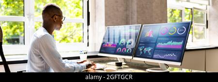 African Advisor Using KPI Dashboard With Financial Analytics Graphs Stock Photo
