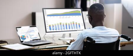 Disabled African Business Man Working In Wheelchair Stock Photo
