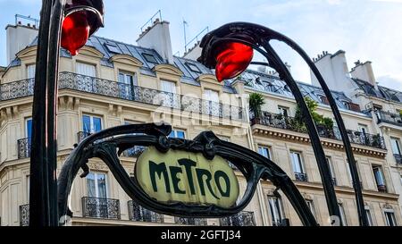 Iconic Paris metro sign in the 2 arrondisement Red lamps. Stock Photo