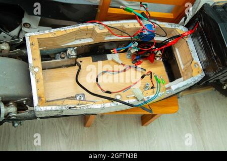 disassembled electric scooter pulled out battery Stock Photo