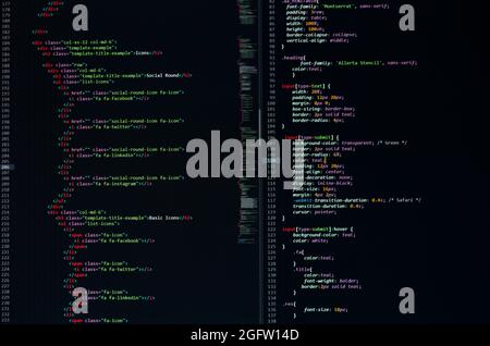 developer python, java script, html, css source code on monitor screen. writing script of software developer. program coding. programmer editing code Stock Photo