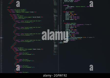 developer python, java script, html, css source code on monitor screen. writing script of software developer. program coding. programmer editing code Stock Photo