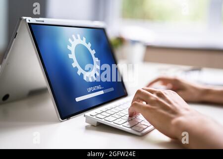 Business Computer Online Update. Software Upgrade Progress Stock Photo