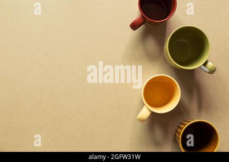 Empty coffee cups on brown background. top view, copy space Stock Photo