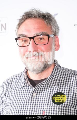 Cineworld Leicester Square, London, UK. 26 August 2021.  Paul Hunt poses at the The Brilliant Terror Media Wall . Picture by Julie Edwards./Alamy Live News Stock Photo
