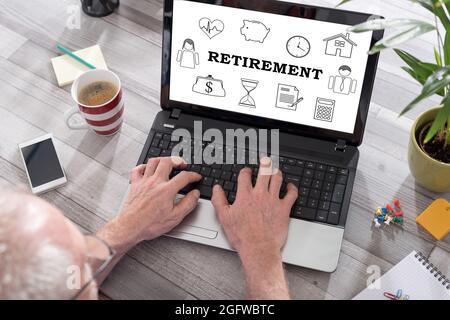 Retirement concept shown on a laptop used by a man Stock Photo