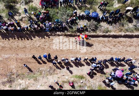 Lhasa, China's Tibet Autonomous Region. 26th Aug, 2021. Aerial photo shows a rider competing during a horse race in Gangdan Village of Gonggar County, southwest China's Tibet Autonomous Region, Aug. 26, 2021. An annual horse racing event was held here on Thursday to celebrate the upcoming harvest season. Credit: Purbu Zhaxi/Xinhua/Alamy Live News Stock Photo