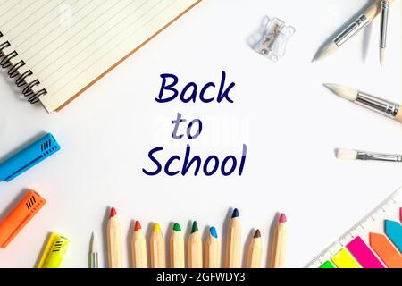 school flat lay, stationery on a white background with text Back to school. top view Stock Photo