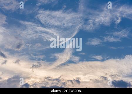 Abstract natural scene of floating clouds on blue sky. Stock Photo