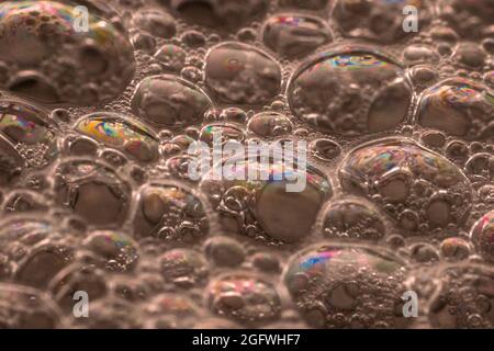 Close-up of soap bubbles in water making an interesting macro pattern Stock Photo