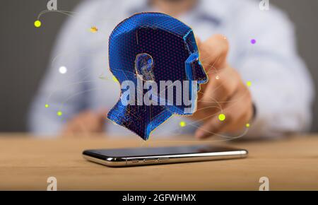 Human head over the smartphone- the concept of artificial intelligence Stock Photo