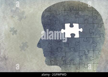 Silhouette of a head on a textured background, puzzle with missing part, thinking, mind, reminder Stock Photo