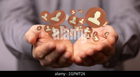 Hand holding icons connected to each other - the concept of digital networking Stock Photo