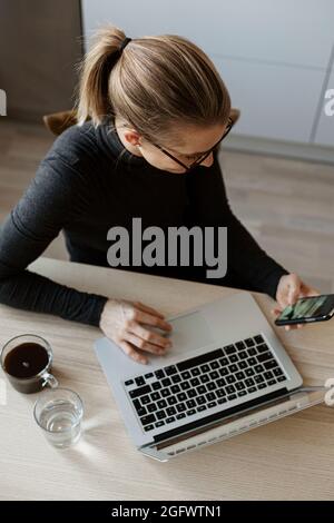High angle view of woman using cell phone Stock Photo
