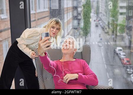 Man and woman having video call via smartphone Stock Photo
