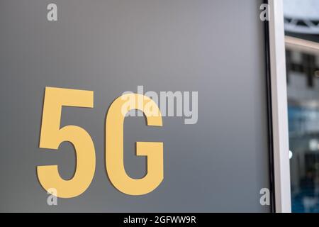 5G inscription on gray wall Stock Photo