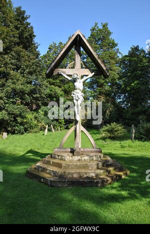 Statue of The Crucifixtion of Christ situated in the churchyard of St Mary's Church, Acton burnell Stock Photo