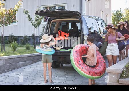 Family packing car before holiday Stock Photo