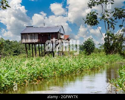 Belen, Peru- Dec 2019: Houses on the water in the floodplain of the Itaya River, poorest part of Iquitos - Belén. Venice of Latin America. Iquitos, So Stock Photo