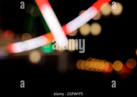 Abstract circular  bokeh background, blurred colourful night city lights. Stock Photo