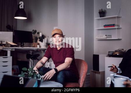 Mature man sitting in office Stock Photo
