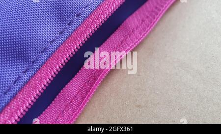 Pencil case with pink zip on neutral background Stock Photo