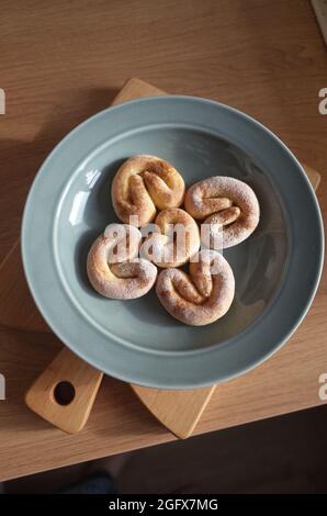 Cotage cheese homemade cookies on the shining grey plate on the wooden table, geometrical ornament Stock Photo