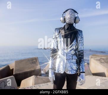 Mr disco man with sparkly face and headphones Stock Photo
