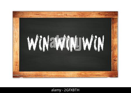 WIN  WIN  WIN text written on black wooden frame school blackboard. Stock Photo