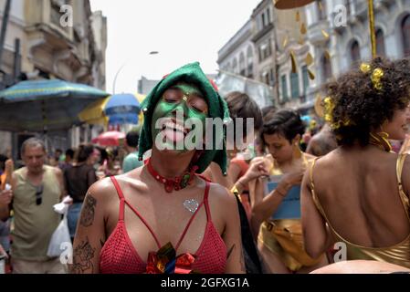 Brazil–February 16, 2020: A woman in costume sticks out her tongue during the Carnival in Rio de Janeiro, an event with international tourist interest Stock Photo