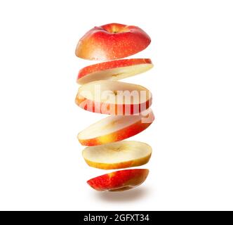 levitating sliced red apple isolated on white background Stock Photo