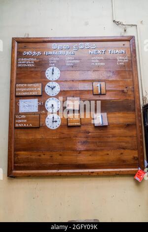 NANU OYA, SRI LANKA - JULY 17, 2016: Wooden timetable on a train station in Nanu Oya village, Sri Lanka Stock Photo