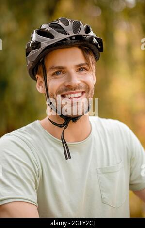High-spirited sporty Caucasian guy wearing protective headgear Stock Photo