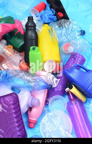 group of plastic containers on blue plastic bags Stock Photo