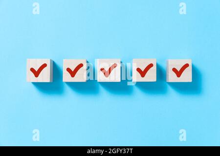 Red tick marking on checklist Stock Photo